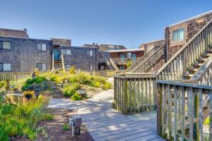 a wooden walkway with stairs in a garden at Watsonville Condo with Ocean Views and Beach Access in Watsonville