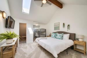 a bedroom with a bed and a tv in it at Come stay at the Elm Grove Elegance Irene! in Boise