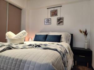 a bedroom with a bed and a chair in it at La Floresta in Quetzaltenango