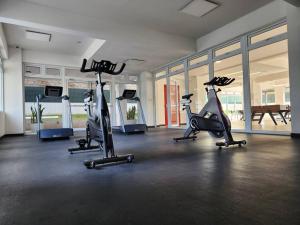 a gym with three exercise bikes in a room at La Floresta in Quetzaltenango