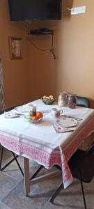 a table with a table cloth on it with food on it at 2 chambres au calme Villa Chrisma Provence in Orgon
