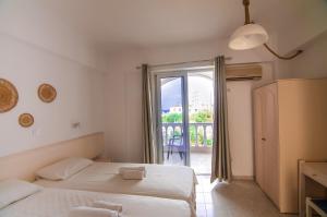 Postel nebo postele na pokoji v ubytování Irene Apartments