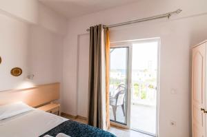 Postel nebo postele na pokoji v ubytování Irene Apartments