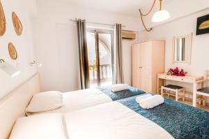 Postel nebo postele na pokoji v ubytování Irene Apartments