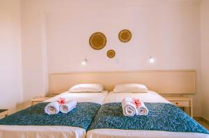 Postel nebo postele na pokoji v ubytování Irene Apartments