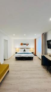 Ένα ή περισσότερα κρεβάτια σε δωμάτιο στο Hotel Libers