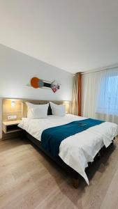 Een bed of bedden in een kamer bij Hotel Libers