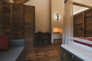 Postel nebo postele na pokoji v ubytování Rifugio Lago Malghette