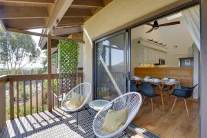 a patio with chairs and a table on a deck at Quaint La Mesa Townhome, Pet Friendly with Fee! in La Mesa