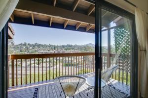 a screened in porch with a table and chairs on a balcony at Quaint La Mesa Townhome, Pet Friendly with Fee! in La Mesa