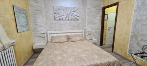 Postel nebo postele na pokoji v ubytování B&B Le Palme