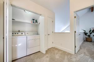 a white laundry room with a washer and dryer at Come stay at the Elm Grove Elegance Irene! in Boise