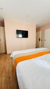 Voodi või voodid majutusasutuse Hotel Libers toas