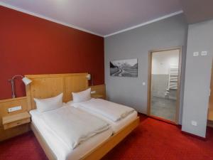 Postel nebo postele na pokoji v ubytování Hotel Vollmann