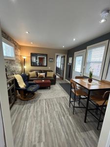 a living room with a couch and a table at The Inn on Bay in Gravenhurst