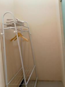 a ladder in a room with a shelf at Kelud Syariah Guesthouse in Blitar