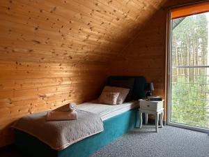 Posteľ alebo postele v izbe v ubytovaní Resort EDEN domki, apartamenty i pokoje