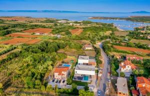 an aerial view of a house with a road at Villa Grande Arche Istria in Ližnjan +50 photos
