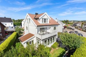 an aerial view of a white house at Lund Apartment in Kristiansand