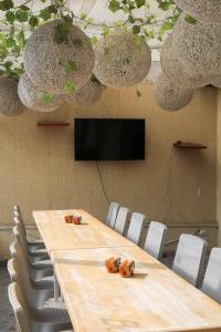 a conference room with a long table and chairs at Hotel Casa botero 106 in Bogotá