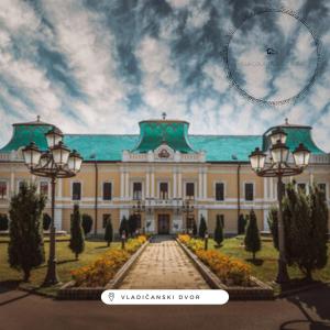 a large building with two lights in front of it at Villa Countryside Vrsac in Vršac