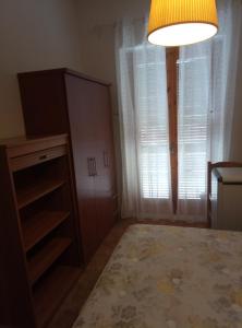 Postel nebo postele na pokoji v ubytování Yucca Apartment Scalea