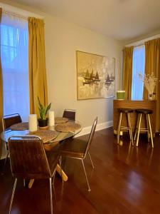 a dining room with a table and chairs at Cute Charming Vintage Townhome in German Village in Columbus
