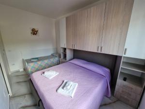 Postel nebo postele na pokoji v ubytování San Marco Beach App Maestrale