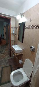 a bathroom with a toilet and a sink at Casa Bonita in Juella +13 photos
