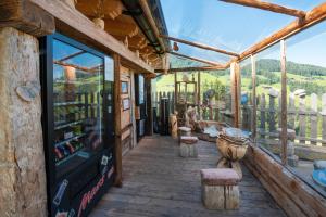 a porch of a building with windows and artifacts at Apartmenthaus Rosenhof in Alpbach