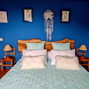 Postel nebo postele na pokoji v ubytování Casa dos Amigos