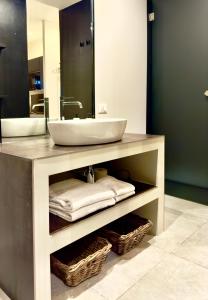 a bathroom with a sink and a mirror at Podere Gattabigia in Lastra a Signa