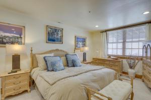 a bedroom with a large bed with blue pillows at Edwards Home in Cordillera Hot Tub, Mountain View in Edwards