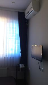 Телевизия и/или развлекателен център в Hotel Mimoza
