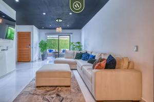 a living room with a couch and a table at Sonnrisa Condominums 1 in Puerto Vallarta