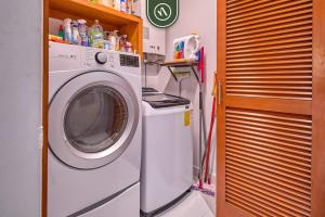 a washer and dryer in a small room at Sonnrisa Condominums 1 in Puerto Vallarta