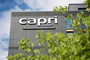 a large building with a sign on the side of it at Capri by Fraser, Frankfurt in Frankfurt