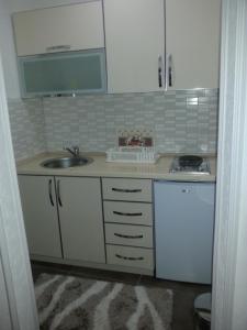 a kitchen with a sink and a counter top at Apartments Debora in Ulcinj +69 photos
