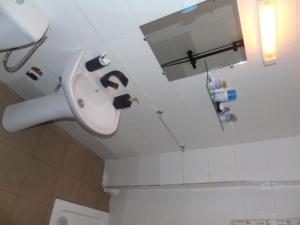 a bathroom with a sink and a toilet at Welcome To Our Lovely 3-Bed Apartment in Abidjan in Cocody