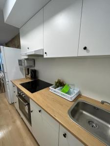 Una cocina o zona de cocina en Apartamento Baixo da Barbeira