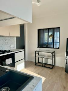 Kuchyň nebo kuchyňský kout v ubytování Apartment ZOi