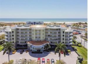an aerial view of a hotel with the beach at Crystal Palms Resort Treasure Island Penthouse Unit 603 in St Pete Beach