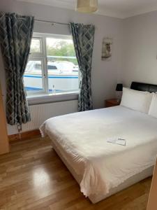 Ліжко або ліжка в номері Padua Guest Accommodation Rosslare