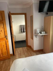 Ліжко або ліжка в номері Padua Guest Accommodation Rosslare