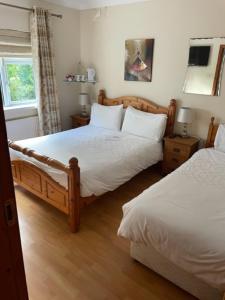 Ліжко або ліжка в номері Padua Guest Accommodation Rosslare