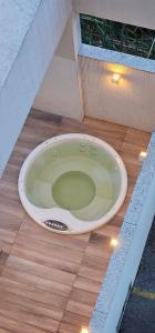 a toilet sitting on the floor of a building at Option Full Service Residence in Rio de Janeiro