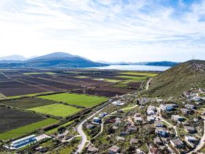 an aerial view of a town on a hill with a lake at Villa La Quiete - Adults only in Ksamil