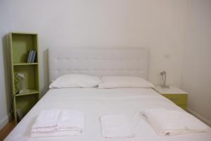 Letto o letti in una camera di Via Gattini Suite