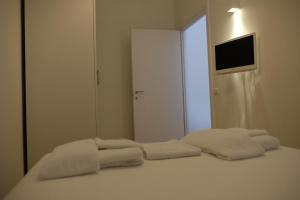 Letto o letti in una camera di Via Gattini Suite