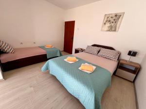 Postel nebo postele na pokoji v ubytování Guesthouse Civovic